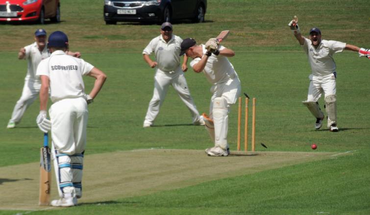 Jonathan Strawbridge bowled first ball by Adam James as Huw Scriven celebrates behind the wicket